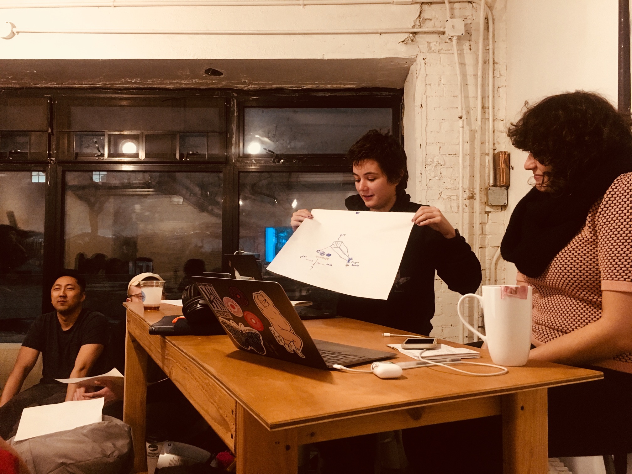 "AC Gilette presenting a collaborative drawing done with Nadja Oertelt."