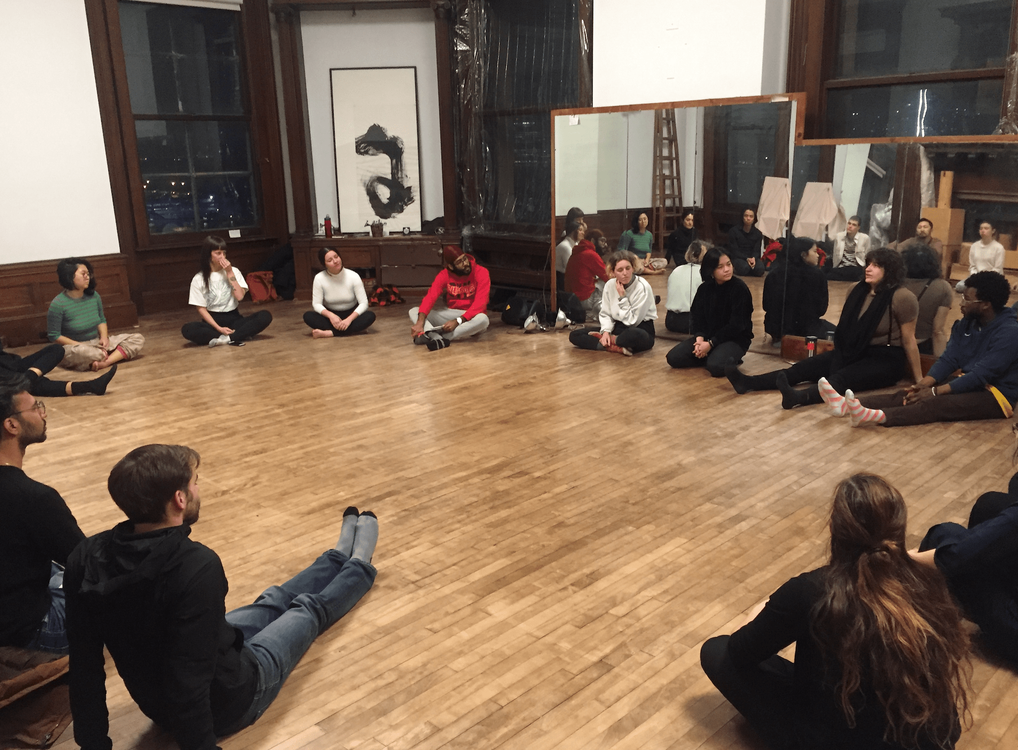 students sitting in circle westbeth dance studio with FlucT