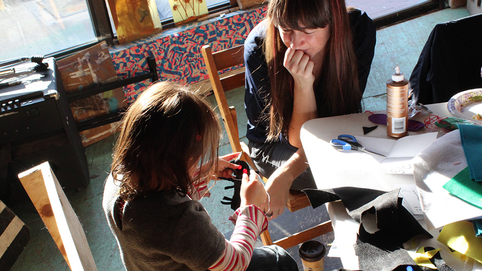 two people working with textiles and electronics