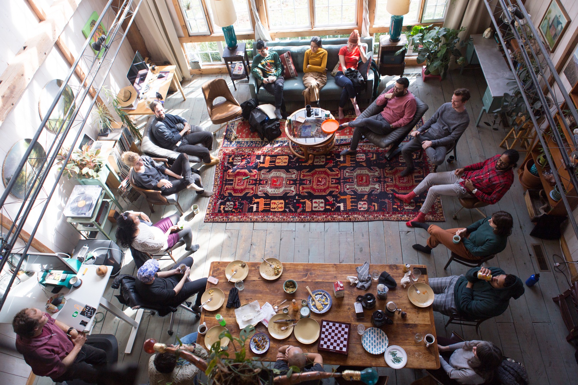 Overhead view of sfpc teachers in a circle during a retreat, discussing and eating