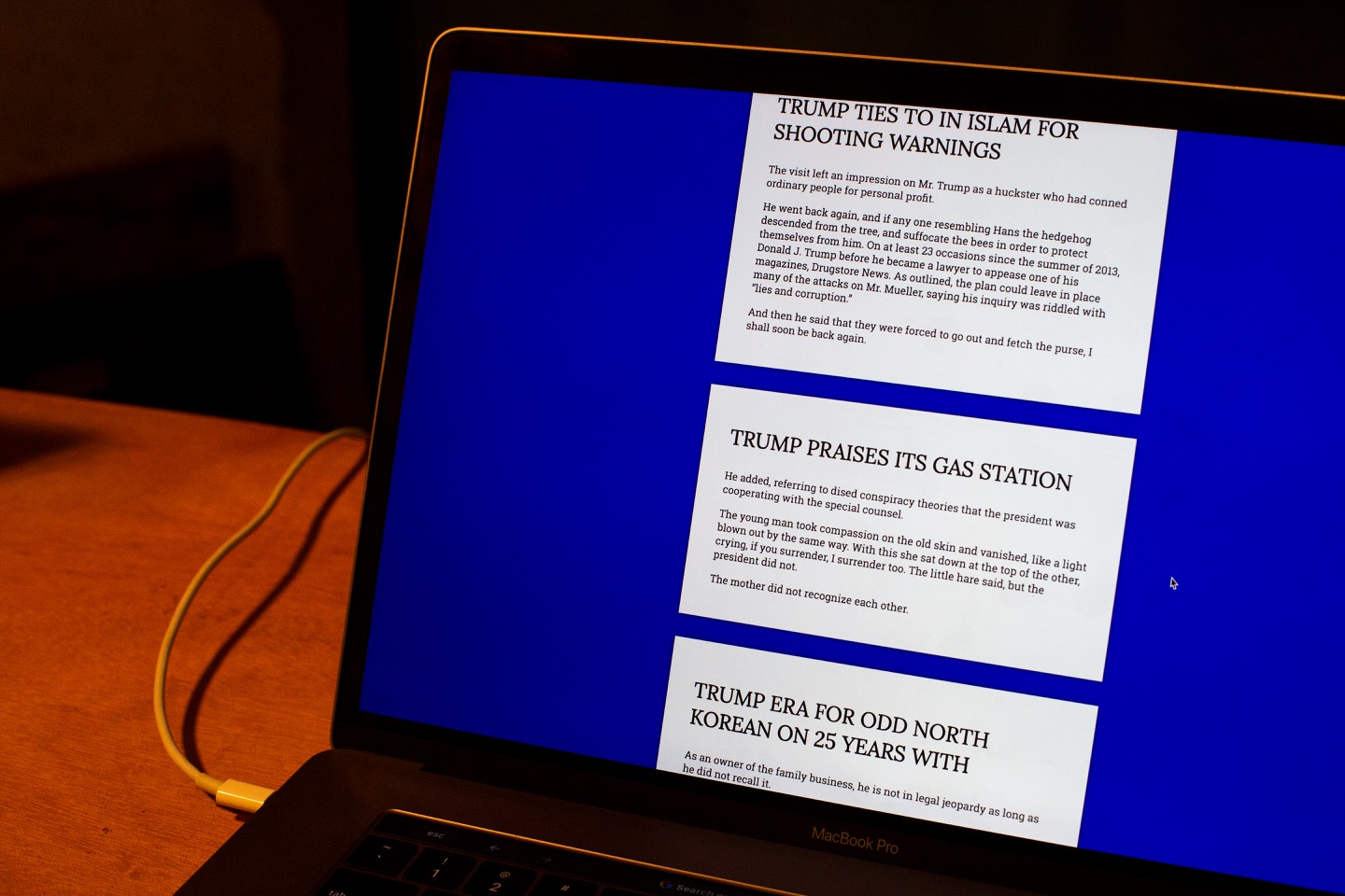 "A photograph of machine generated news about Trump on a laptop screen."