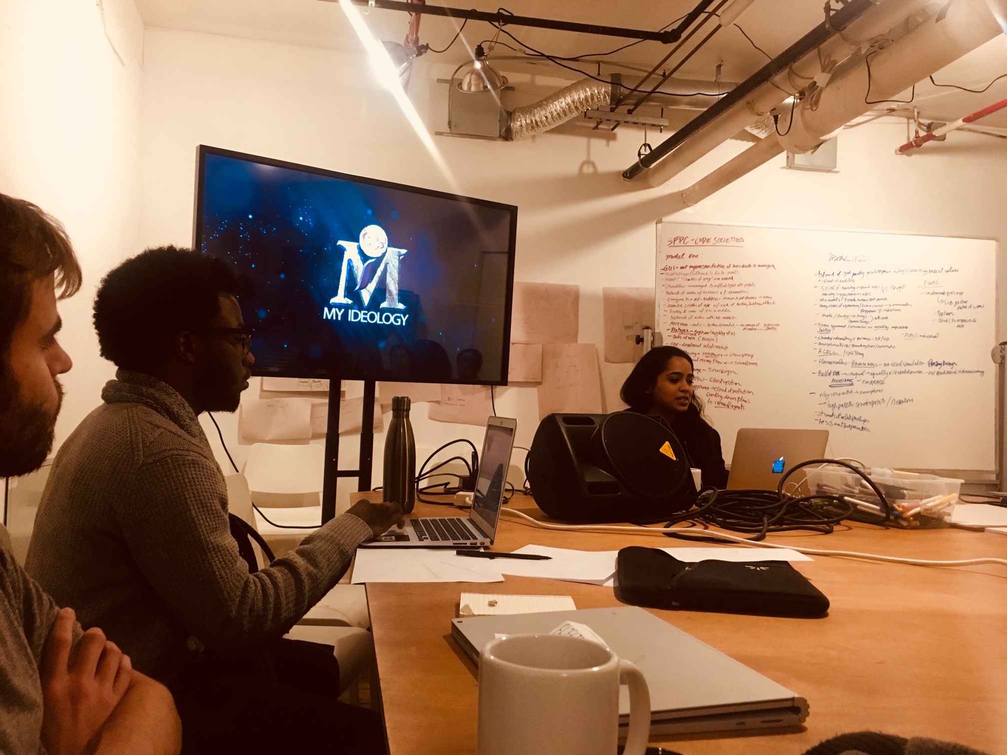 "Nora Khan sitting at the front of the class presenting a lecture at Code Societies Winter 2019. "