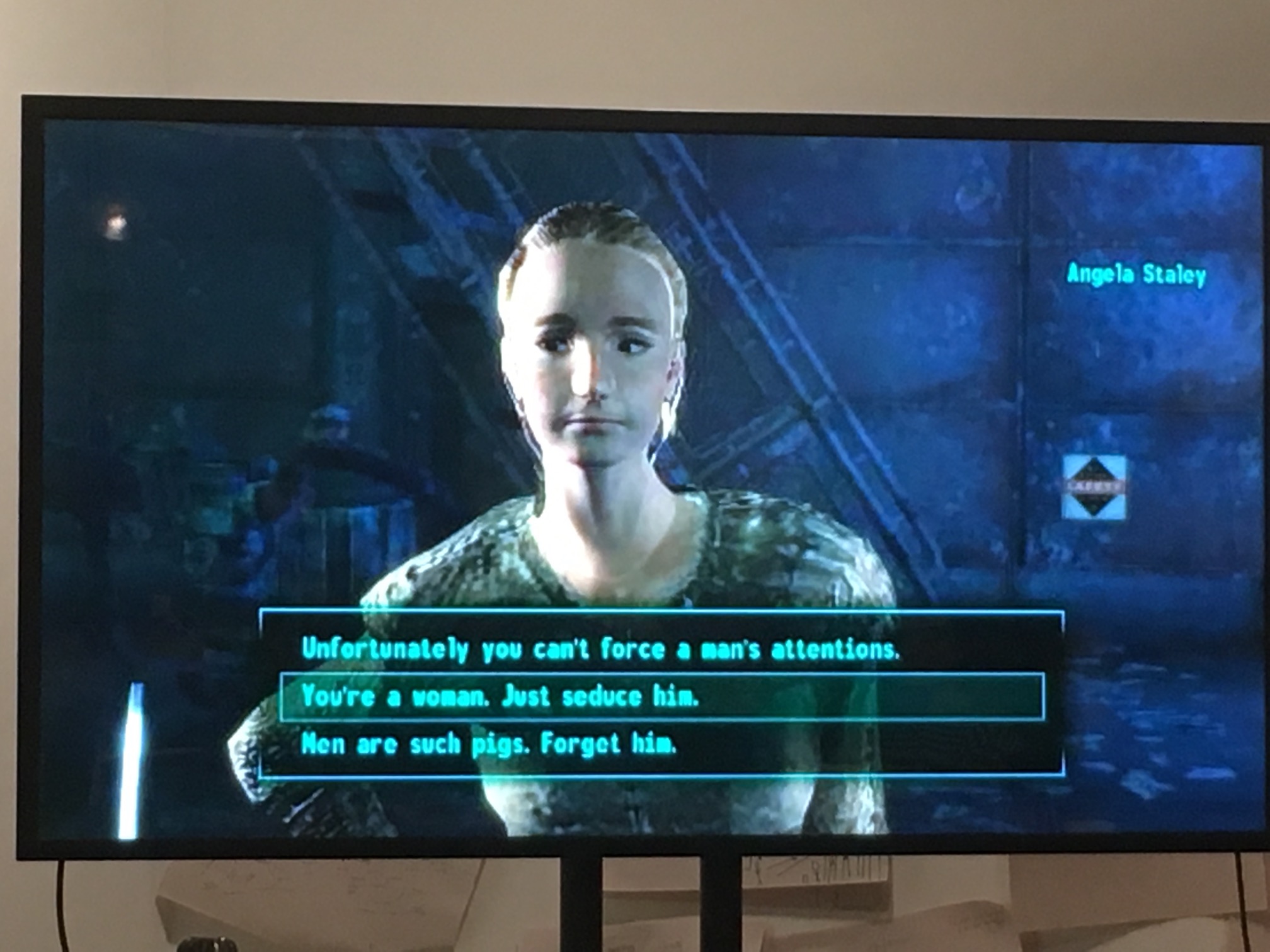 "Screenshot from Nora's presentation showing a female presenting character from Fallout 1 with the options: Unfortunately you can't force a man's attention; You're a woman. Just seduce him; Men are such pigs. Forget him."