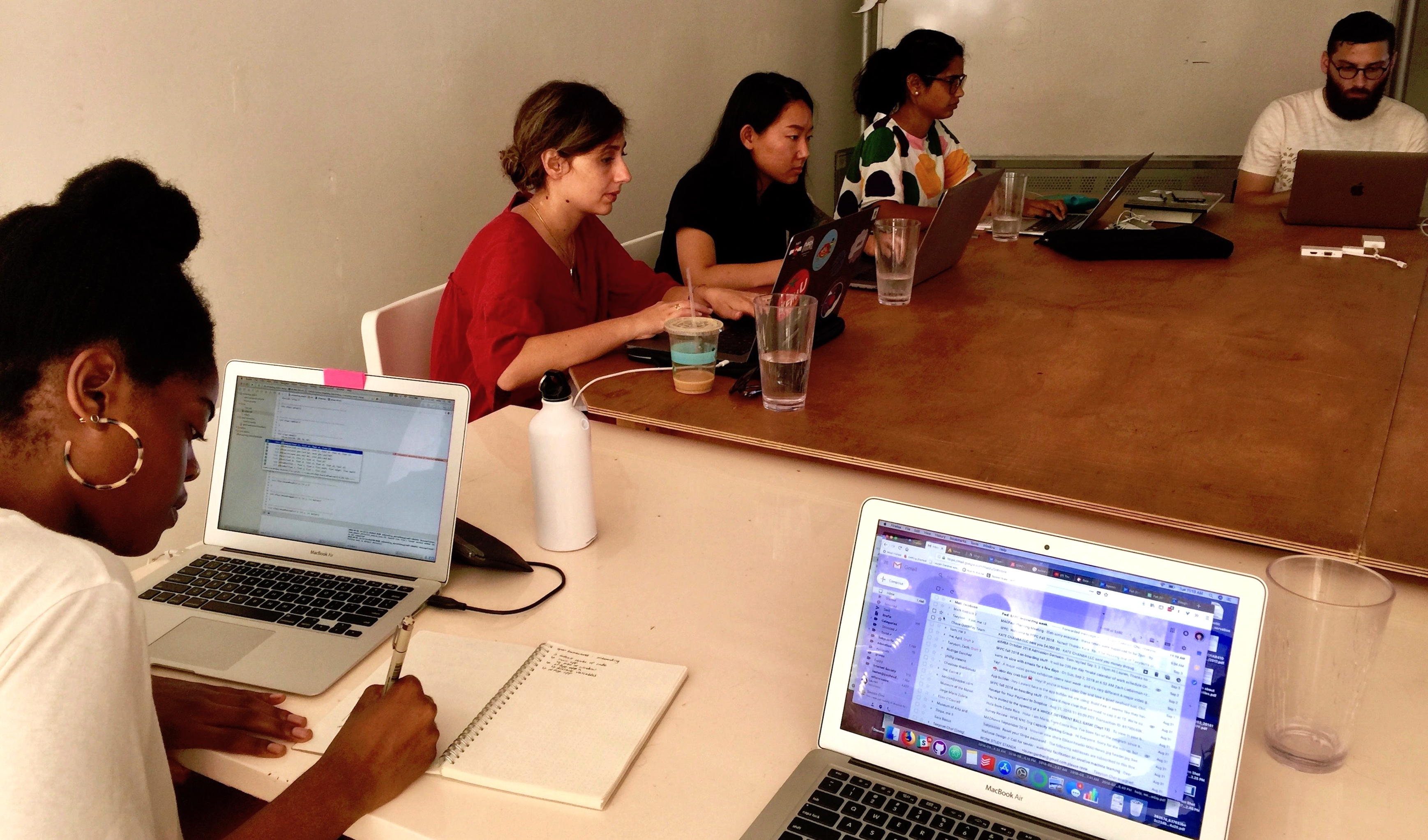 people studying at laptops in SFPC space